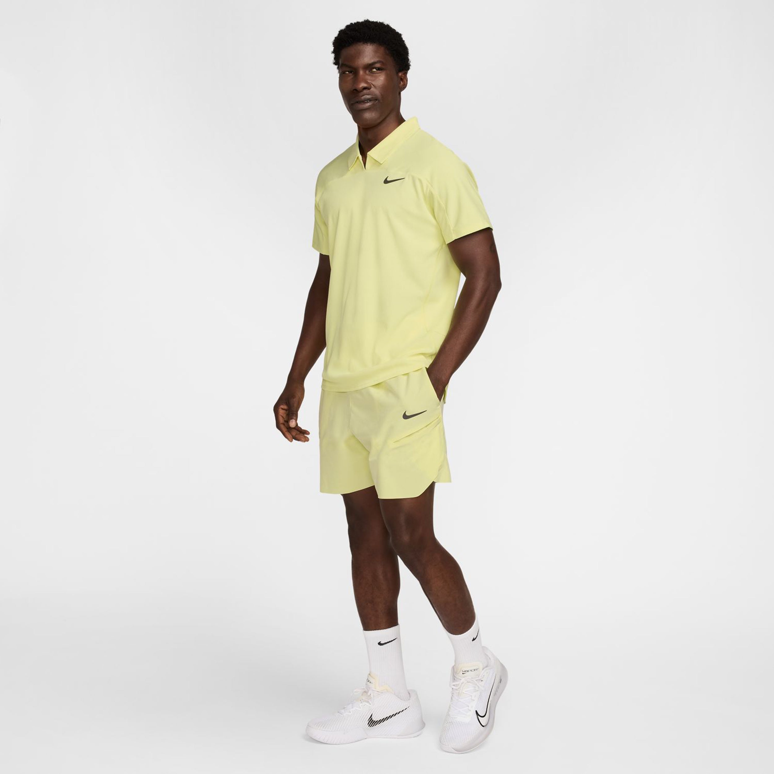 yellow nike polo shirt
